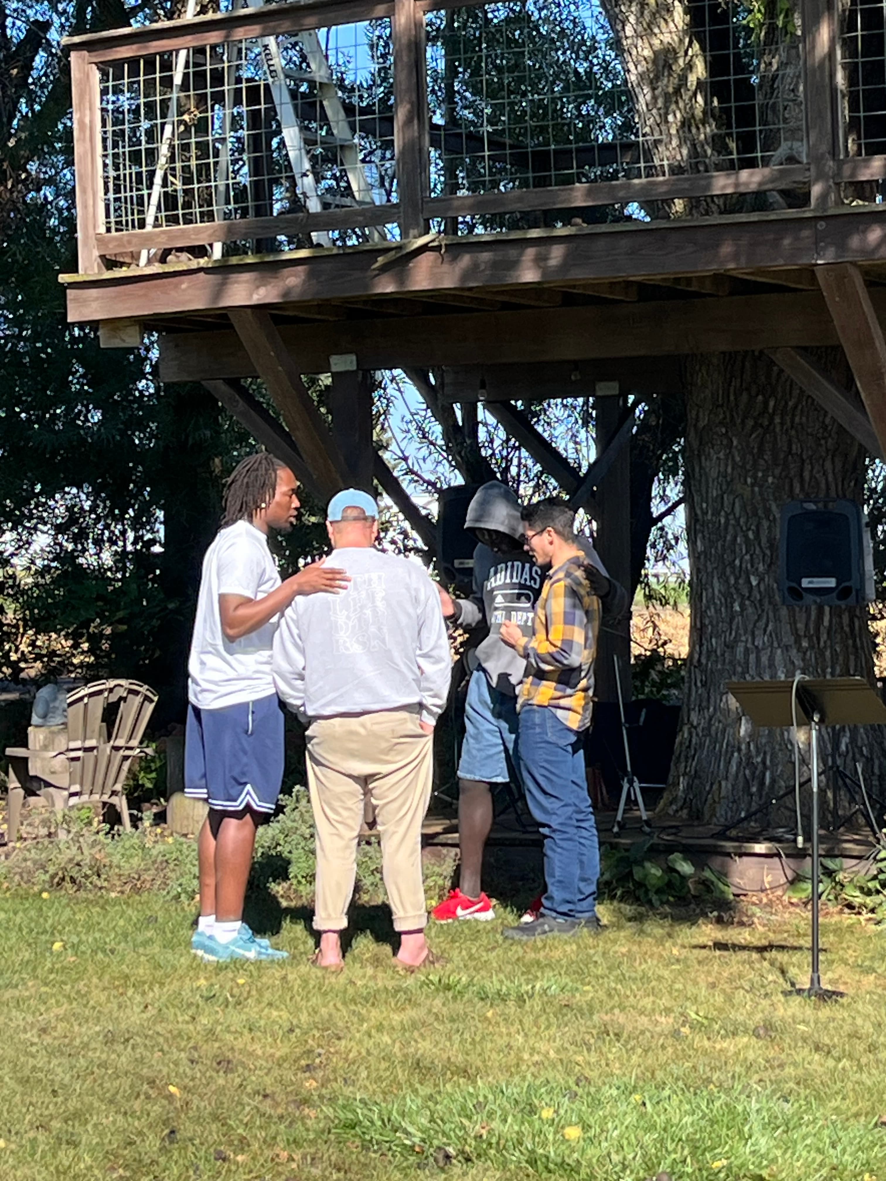 Pastors in prayer at an outdoor Church For Pastors gathering.